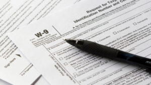 Medzam Consulting -Understanding Forms W-4 and W-9 Essential Tax Documents